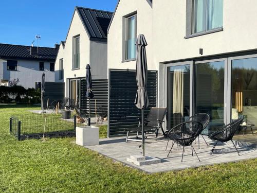 Nadmorska Otulina Nowoczesne dwupoziomowe domki nad morzem z dużym ogrodem in Ustka, Poland