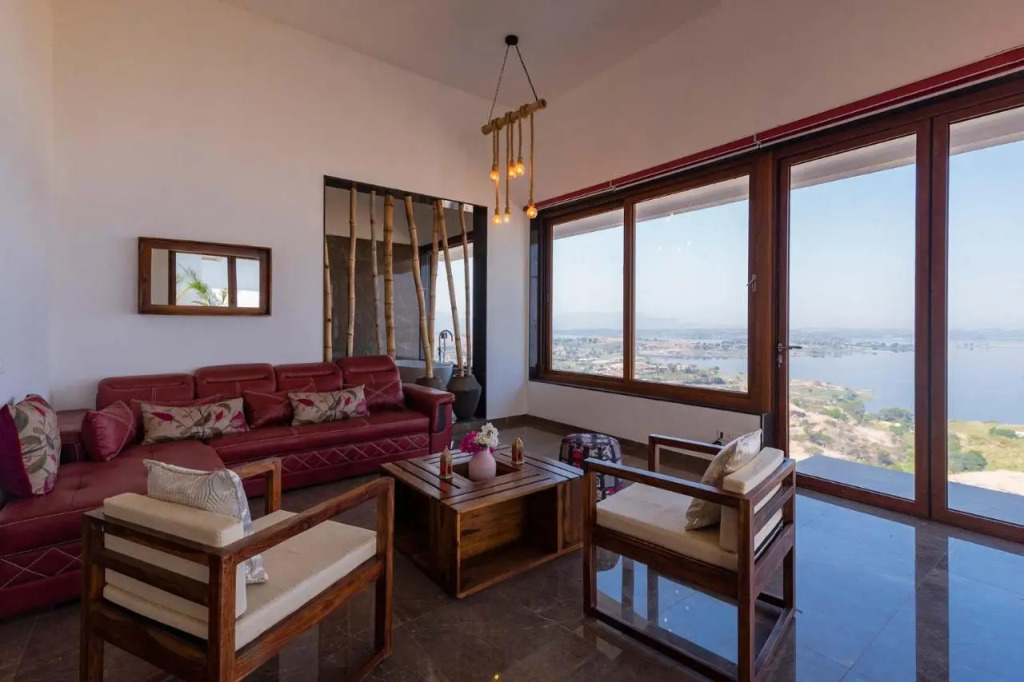 StayVista at Sunset on the Lake Infinity Lakeview Swimming Pool with Contemporary Interiors & Lavish Amenities