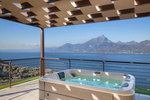 Terrace of Wally Apartment With Pool — 4-Star Luxury Hotel in Torri Del Benaco, Italy