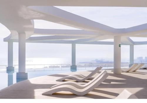 Boutique H8 Beach Roof Terrace Infinity Pool Bar SPA Padel Swimming Pool — hotel in Canet D'en Berenguer
