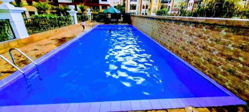 Elegant modern retreat residencies with swimming pool fully equipped gym and rooftop chillspot with amazing breathtaking city views
