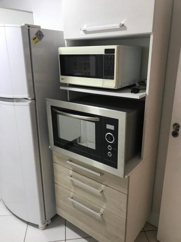 Apartamento á 30 metros praia com vista mar.