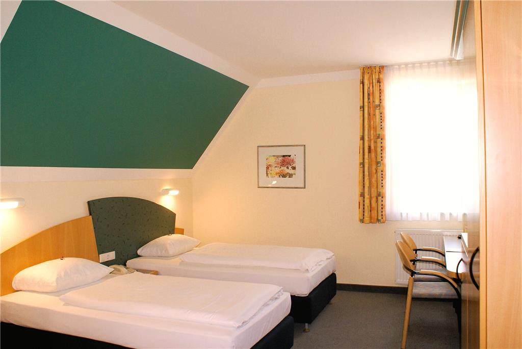 Double room with double bed, desk, spacious wardrobe, wall mirror, seating, TV, bathroom